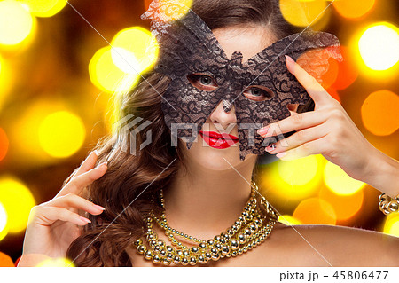 Beauty model woman wearing venetian masquerade carnival mask at party 45806477
