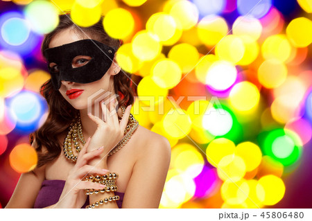 Beauty model woman wearing venetian masquerade carnival mask at party 45806480