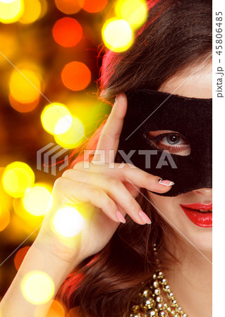 Beauty model woman wearing venetian masquerade carnival mask at party 45806485