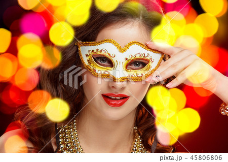 Beauty model woman wearing venetian masquerade carnival mask at party Beauty model woman wearing venetian masquerade carnival mask at party 45806806