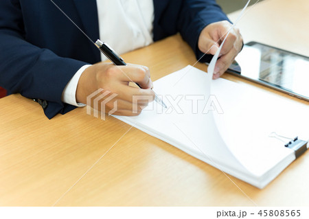 Businessman signing contract paper with pen in office desk. Businessman signing contract paper with pen in office desk. 45808565