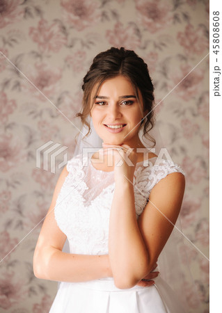 Young bride in white wedding dress. Charming and tenderness lady wait for a groom 45808608