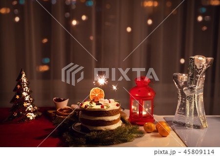 A Sparkler in the cake at night at Christmas time 45809114