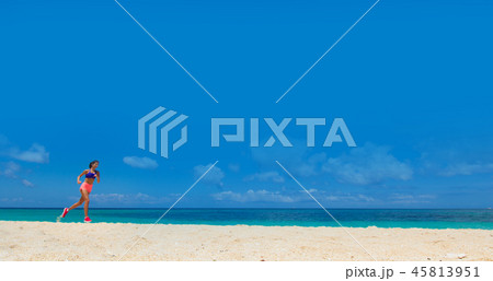 Woman running on summer beach 45813951