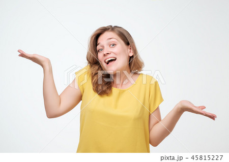 Young happy student shrugging in doubt. Is in not my business 45815227