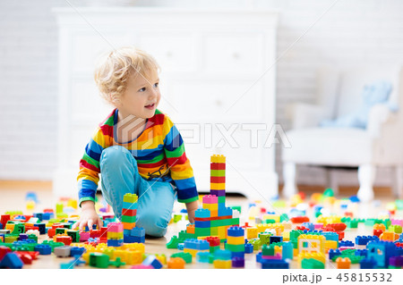 Child playing with toy blocks. Toys for kids. Child playing with toy blocks. Toys for kids. 45815532