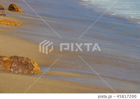 Coast of the Pacific Ocean with traces of waves with stones. 45817200
