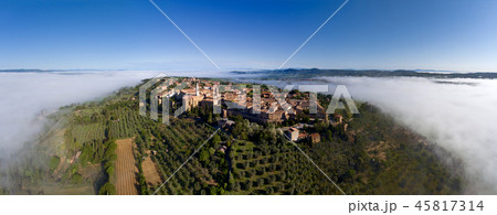 Old Italian city on top of hill in fog 45817314