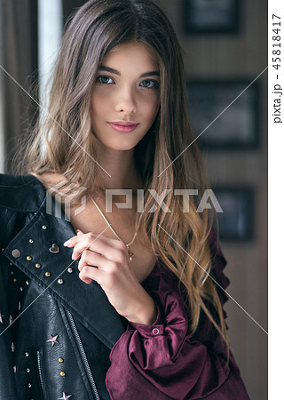 Young beautiful girl in a leather jacket Young beautiful girl in a leather jacket 45818417