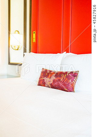 Comfotable pillow on bed with light lamp decoration Comfotable pillow on bed with light lamp decoration 45827916
