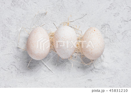 Three fresh turkey eggs on the white table Three fresh turkey eggs on the white table 45831210