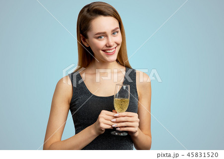 Beautiful girl with a glass of champagne  Beautiful girl with a glass of champagne  45831520