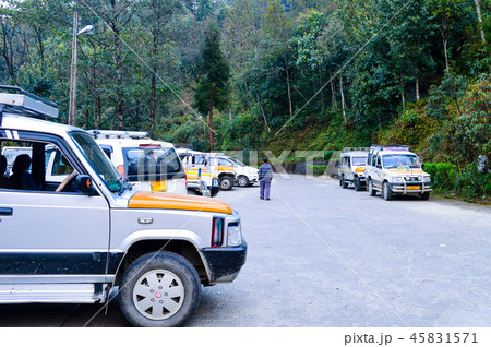 Tourist Cars parked pavement. Kaushani, India. 45831571