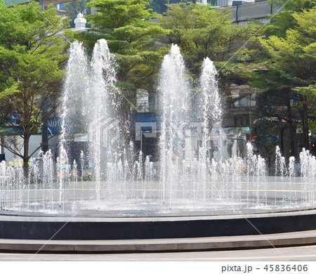 The fountain is blasting up high. 45836406