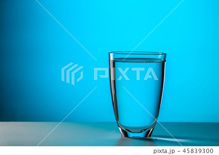 Glass on dark blue background 45839300