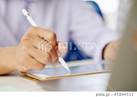 Crop man working on tablet with stylus 45844511