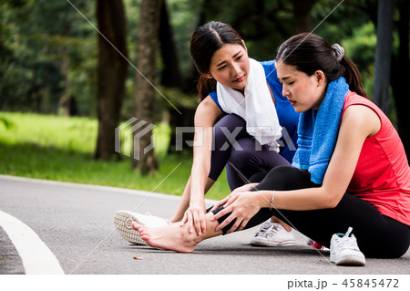 Asian woman is getting ankle injury while exercise 45845472