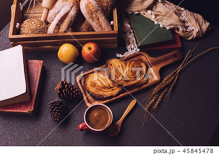 Breakfast scene with coffee cup, bread and fruits 45845478