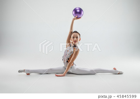 The teenager girl doing gymnastics exercises - Stock Photo