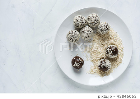 Energy ball on plate in sesame seeds Energy ball on plate in sesame seeds 45846065