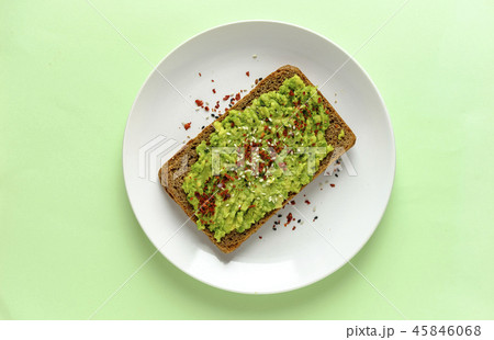 Smashed avocado toast with chilli and copy space Smashed avocado toast with chilli and copy space 45846068