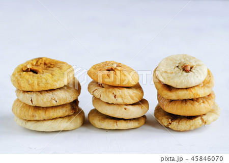 Stacks of dried figs on white backdrop 45846070