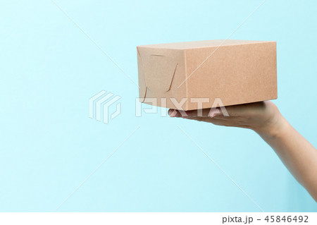 Woman hand hold the brown corrugated box 45846492