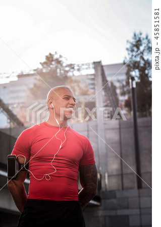 Joyful positive sportsman being in a good mood 45851581