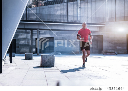 Nice good looking man having an outdoor training Nice good looking man having an outdoor training 45851644