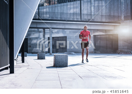Handsome athletic man running in the city Handsome athletic man running in the city 45851645