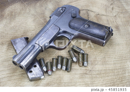 Old rusty handgun on wooden backgroundの写真素材 [45851935] - PIXTA