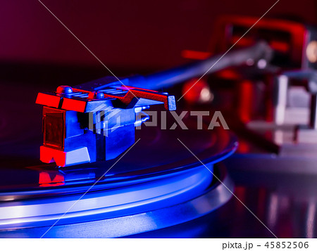 Vintage photo of Old Gramophone, playing a music. Neon light. Cinemagraph, retro record vinyl player Vintage photo of Old Gramophone, playing a music. Neon light. Cinemagraph, retro record vinyl player 45852506