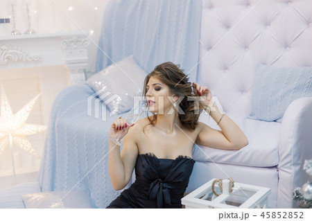 Very beautiful woman drinking champagne in new 45852852