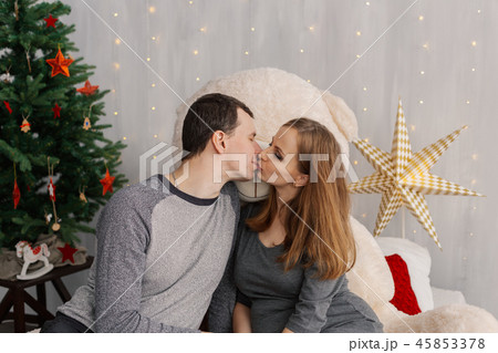 Very beautiful girl and husband on the bed with a Very beautiful girl and husband on the bed with a 45853378