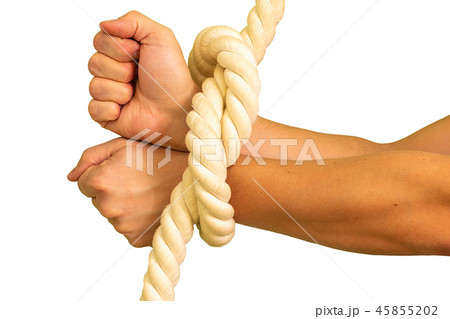 Men's hands are tied in ropes and clenched in their fists. Men's hands are tied in ropes and clenched in their fists. 45855202