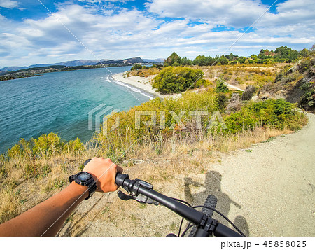 Biking along Lake Wanaka in New Zealand. 45858025