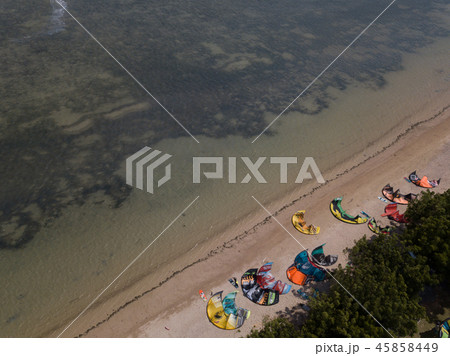 Aerial views, top view of kitesurfing on the waves 45858449