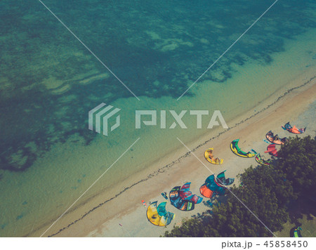 Aerial views, top view of kitesurfing on the waves 45858450