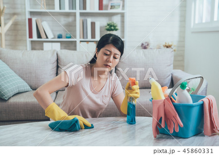 Pretty asian woman doing her house chores Pretty asian woman doing her house chores 45860331