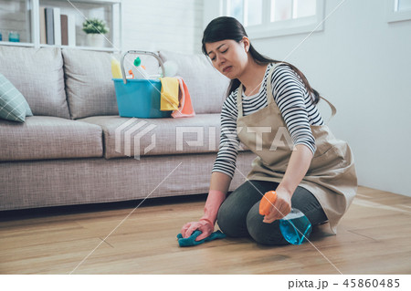 Stressed Young Asian Woman kneeling. Stressed Young Asian Woman kneeling. 45860485