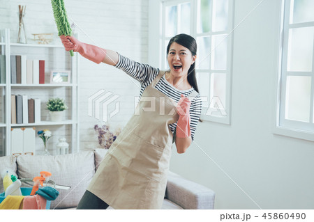 housewife wearing apron doing superman pose 45860490