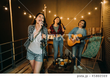 band playing music practicing songs on roof. 45860569