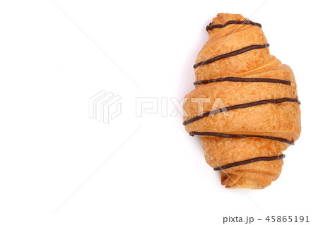 croissant decorated with chocolate sauce isolated on white background with copy space for your text croissant decorated with chocolate sauce isolated on white background with copy space for your text 45865191