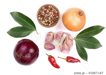 mix of onion, garlic, hot pepper, peppercorn and laurel leaf isolated on white background. Top view mix of onion, garlic, hot pepper, peppercorn and laurel leaf isolated on white background. Top view 45867187