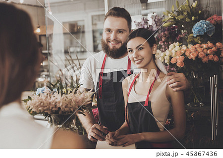 A young girl makes an order in a flower shop A young girl makes an order in a flower shop 45867436