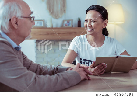 Charming Asian female holding book in both hands 45867993