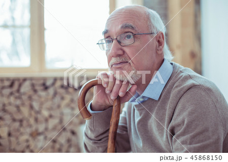 Concentrated senior man dreaming about his family 45868150