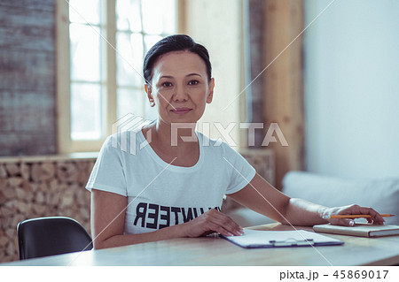 Pleased Asian woman looking straight at camera 45869017