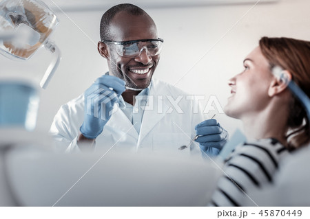 Charming patient listening to her competent doctor 45870449