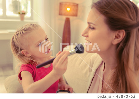 Nice blonde girl learning how to do makeup Nice blonde girl learning how to do makeup 45870752